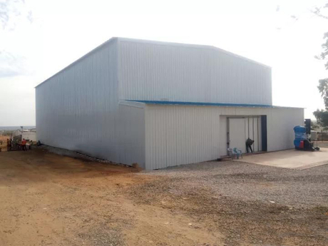 3 storey grey Commercial steel building with living quarters